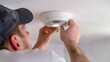 © Natanong - Checking Smoke Detector Batteries for Home Safety and Security