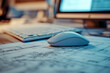 © Fabio - Blueprints with a computer mouse and keyboard nearby, indicating digital work