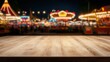© Supriyanto - A wooden tabletop in front of a blurred carnival scene at night.