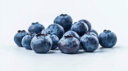 Wall Mural - A close-up of fresh blueberries arranged on a light background.