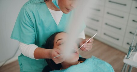 Canvas Print - Women, dentist and patient with dentures for oral care teeth hygiene, treatment and removal. Doctor, surgeon and above on consultation for extraction at medical clinic on canal procedure or surgery