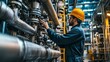© Suleyman - A man is checking long steel pipes and a pipe elbow at an oil factory. He is making sure that the valves are working properly and that there are no leaks.