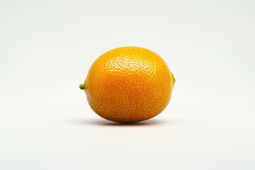 Wall Mural - A single orange sitting on a white surface