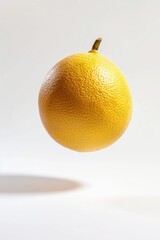 Sticker - A single orange suspended in mid-air on a white background