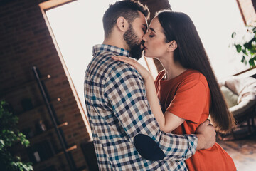 Canvas Print - Photo of happy young couple move new place enjoy live together kissing new apartment room light house flat indoor