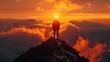 © andriyyavor - A solitary person stands atop a mountain peak, silhouetted against a backdrop of glowing orange clouds at sunset, capturing a moment of triumph and peace in nature.