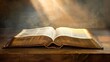 © venusvi - Open book with a bright light emanating from it signifying belief Close-up photo with clean background