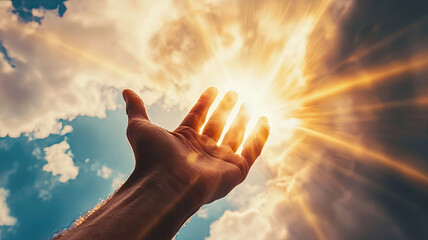 Wall Mural - A divine hand reaching down from sky, surrounded by radiant light