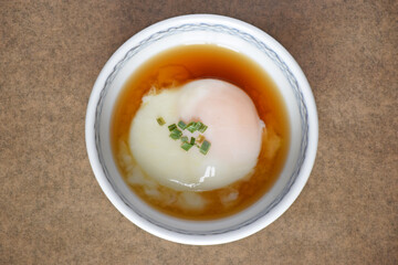 Onsen tamago is a traditional Japanese dish where eggs are slow-cooked in hot spring water. The result is a silky, custard-like egg with a firm white and creamy yolk.