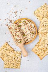 Cookies made from a mixture of flax seeds, sesame seeds, sunflower and pumpkin on a light background. The concept of proper nutrition, healthy lifestyle.