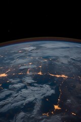 Wall Mural - a globe of planet earth taken from space. the planet is partially illuminated, with the dark side fa