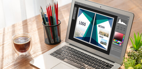 Graphic designer software for modern design of web page and commercial ads showing on the computer screen