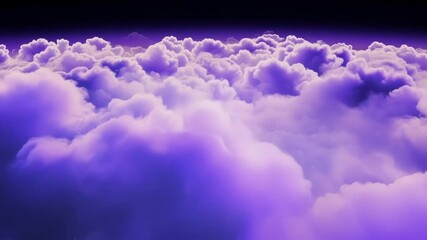 Wall Mural - Beautiful purple cloudscape is filling the entire sky at night creating a breathtaking view. The view from above the clouds at night creates a magical atmosphere