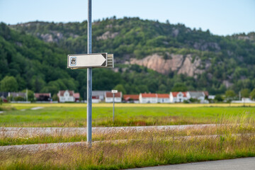 Sign showing the way to a camper van toilet waste station.