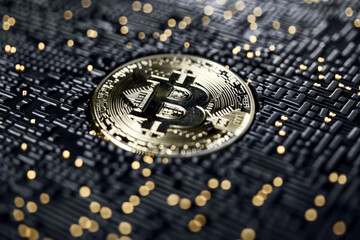 gold bitcoin on black background