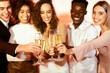 © Prostock-studio - Celebrating Xmas. Cheerful Colleagues Clinking Glasses Toasting With Champagne On Christmas Corporate Party Indoors