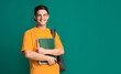 © Prostock-studio - Happy student with books and backpack over turquoise background, copy space