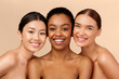 © Prostock-studio - Skin And Body Care. Three Multicultural Ladies Models Posing Smiling At Camera On Beige Studio Background