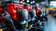 © khonkangrua - A row of red and black industrial engines lined up in a manufacturing facility, showcasing mechanical precision and assembly line production.