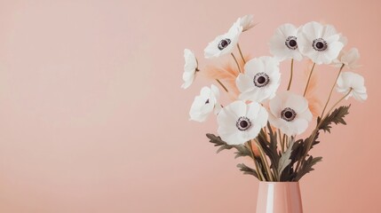 Wall Mural - White anemone flowers in a pink vase on a pastel pink background.