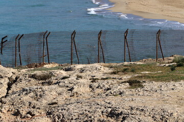 fence fencing on the shore of the Mediterranean Sea.