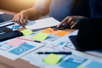 The designer team is designing the uxui system to make the uxui system work well on new phones and support system updates. Website development concept UI UX front end designer