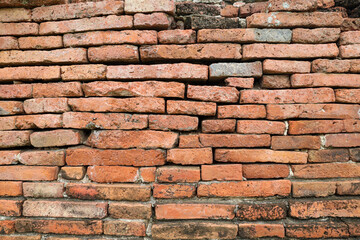 The old brick block wall outdoor with stain and crack for vintage surface texture vintage background.