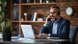 © sungedi - Businessman in Suit Talking on Phone and Working on Laptop