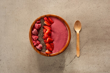 Homemade berry smoothie in a wooden bowl