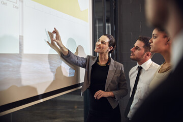 Aufkleber - Boardroom, pointing and group in meeting, monitor and controller with financial report and teamwork. Business, speaker and people in office, listening and discussion of sales and smile for analysis