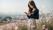 © 미정 최 - Image of a young woman in a field with autumn flowers blooming