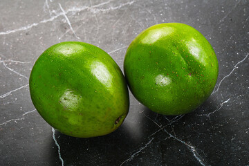 Wall Mural - Two ripe green exotic avocado fruit