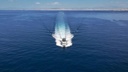 Wall Mural - aerial front view of a modern luxury yacht sailing over the ocean with high speed