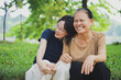 © Timeimage - Young Asian woman with her mother in the park