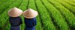 © Jayda_ArtistryHub - Workers in traditional hats harvesting rice by hand in lush green fields, emphasizing cultural heritage and manual labor rice industry, traditional rice farming