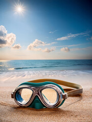 swimming goggles on the beach