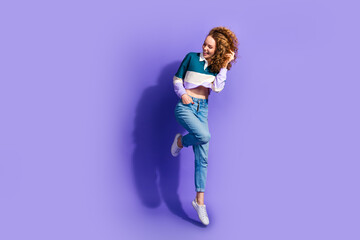 Poster - Full size photo of nice young girl jump empty space isolated on violet color background