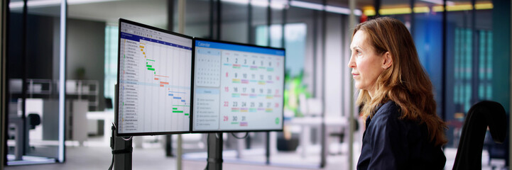 Canvas Print - Employee Working On Calendar Schedule