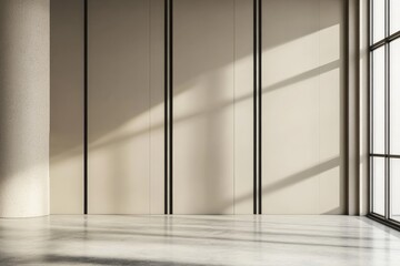 An empty room with large floor-to-ceiling windows casting shadow patterns, creating a serene and expansive space exemplifying the beauty of natural light.