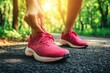 © mohdfaizal - Close-Up of a Runner Tying Pink Running Shoes