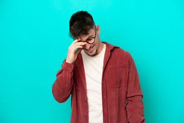 Wall Mural - Young caucasian handsome man isolated on blue background laughing