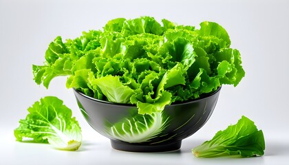 Vibrant green lettuce leaves elegantly arranged in a bowl against a clean white backdrop