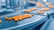 © Daylife - Close-up of an automated conveyor system for orange tablets in a pharmaceutical production line, showcasing efficiency and precision.