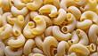 © happyjack29 - Close up raw Macaroni pasta. Uncooked whole grain pasta. Food ingredient background texture