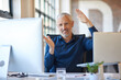 © ThurstanJam/peopleimages.com - Portrait, hands and businessman with office, computer and smile for growth or management. Happy, gesture and mature agent in workplace for insurance, consulting or financial advice at accounting firm