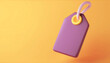 © Nim9ty  Pics - A vibrant purple tag hanging against a warm orange background, ideal for price or branding applications.