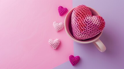 Wall Mural - Pink handmade crochet heart in waffle cup on pink and purple background