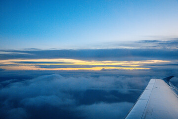 China Shanghai - Sunrise above the clouds from the plane