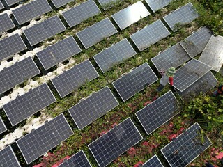 Male workers repair Floating solar panels on water lake. Engineers construct on site Floating solar panels at sun light. clean energy for future living. Industrial Renewable energy of green power.