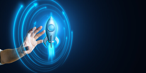 Wall Mural - Hand reaching towards a digital rocket with neon blue arrows on a dark background.